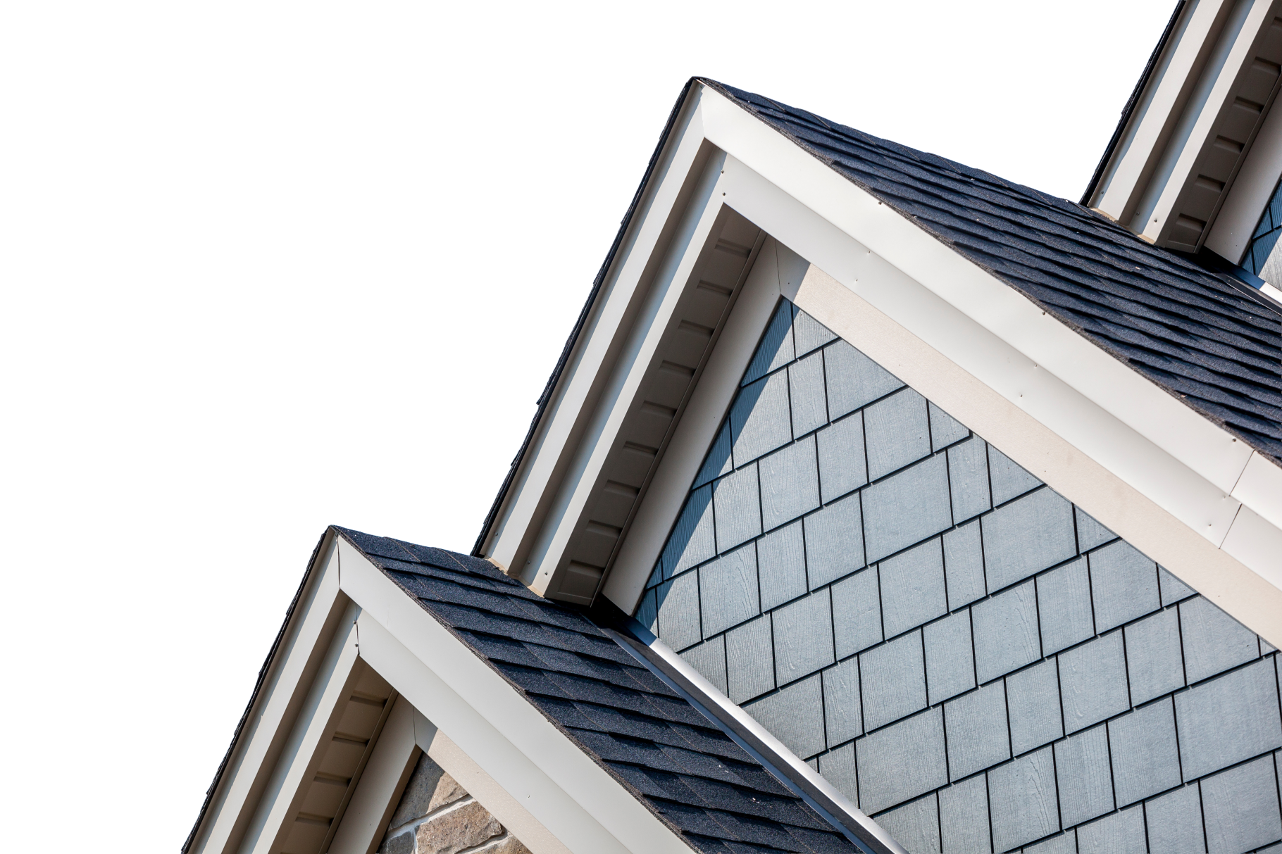 Close-up of dark asphalt shingle gables with white trim and grey shingle siding