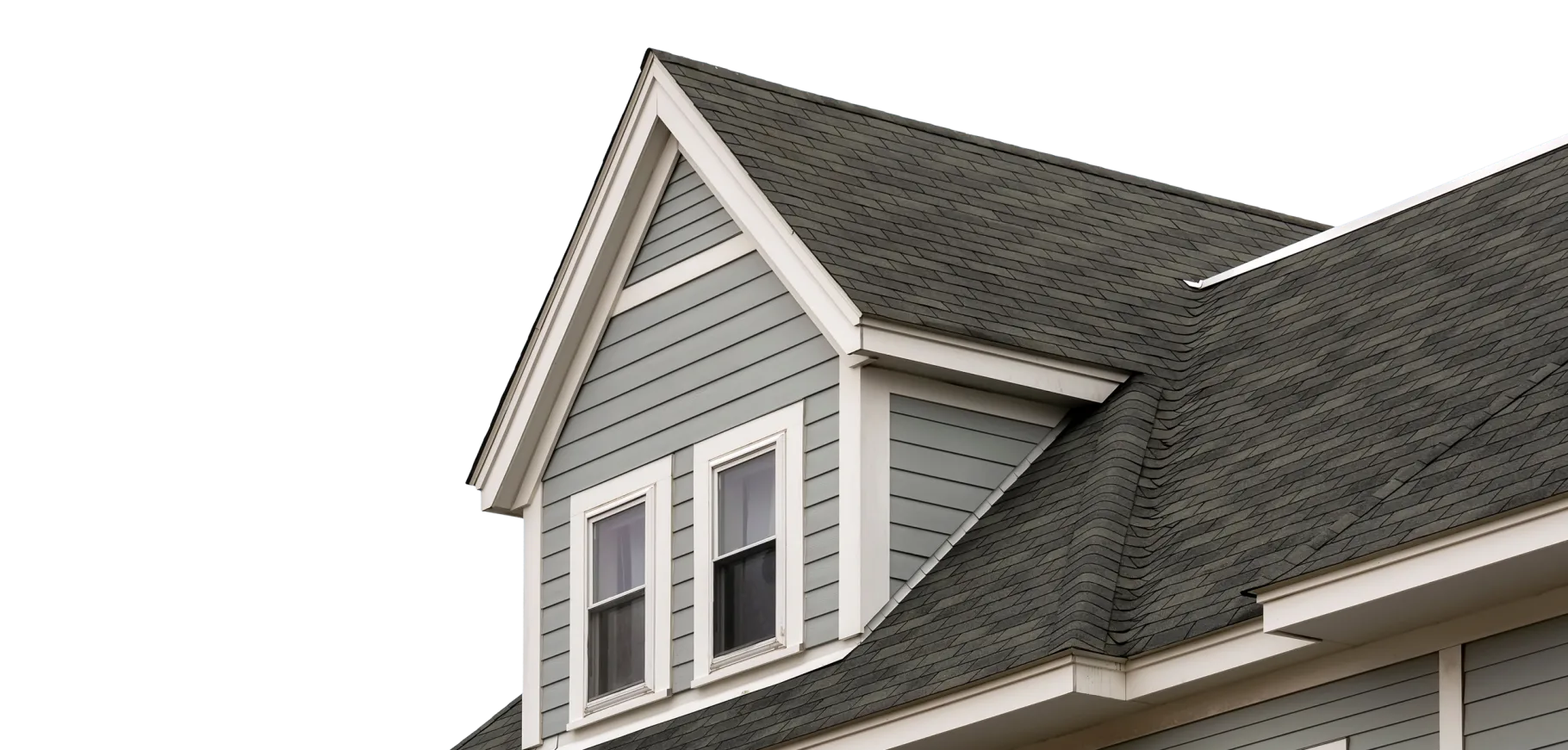 Grey house gable with a dormer, shingle roof and lap siding