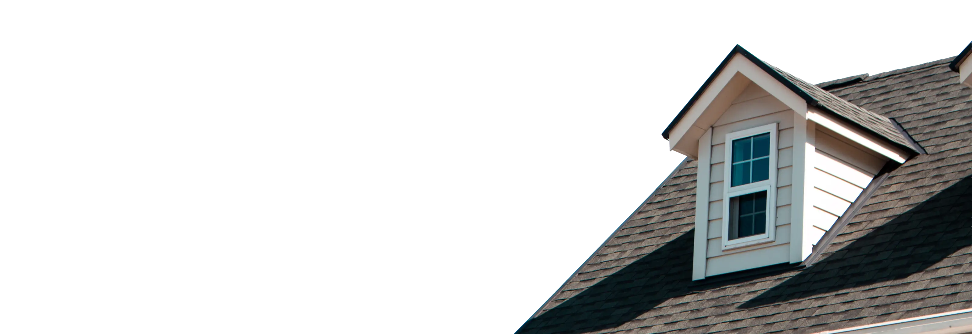 Shingle roof with a white dormer window against a blue sky