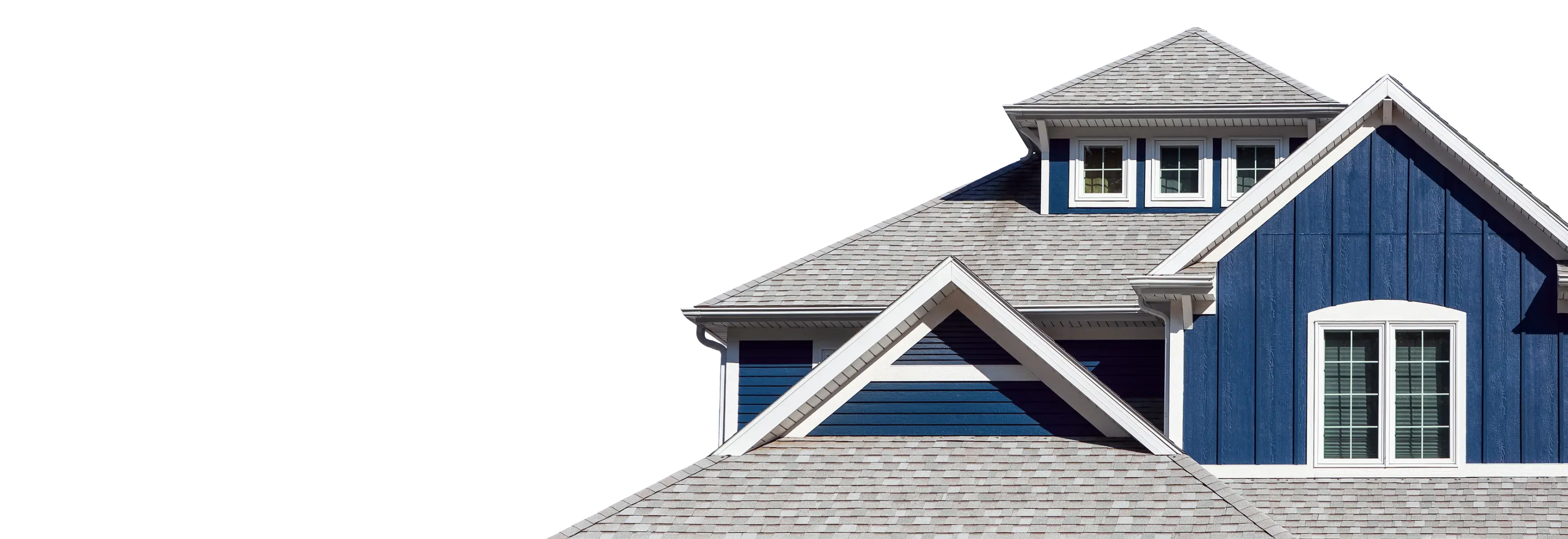 Navy blue house with a grey shingle roof against a blue sky